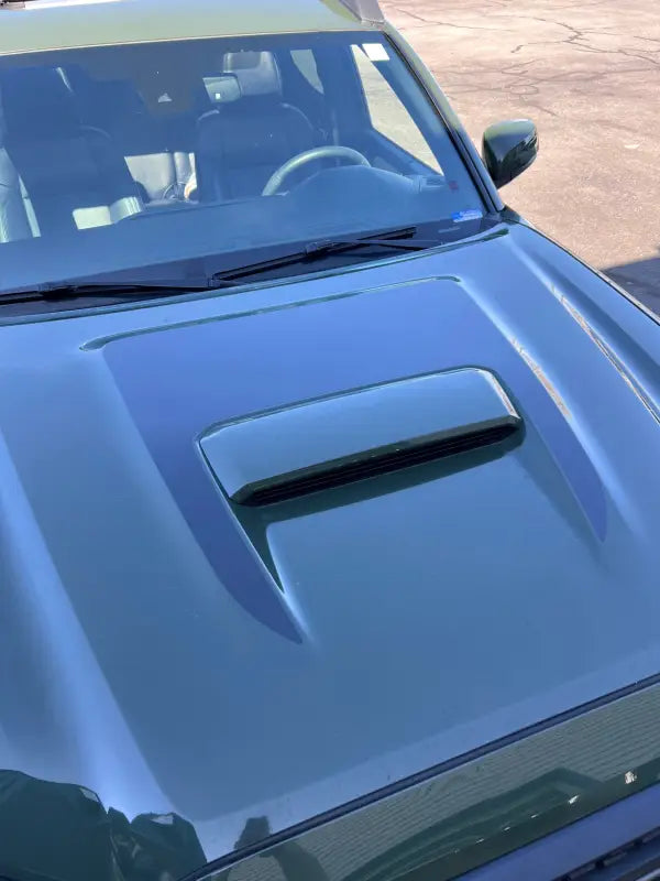 Green car hood with scoop featuring Tacoma Sport Pro Sport Hood Stamp