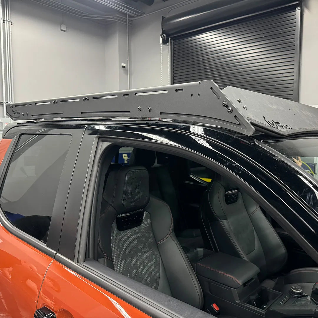 Interior view of Prinsu Pro Cab Roof Rack on a Toyota Tacoma, emphasizing its precision fit, sturdy construction, and no-drill installation.