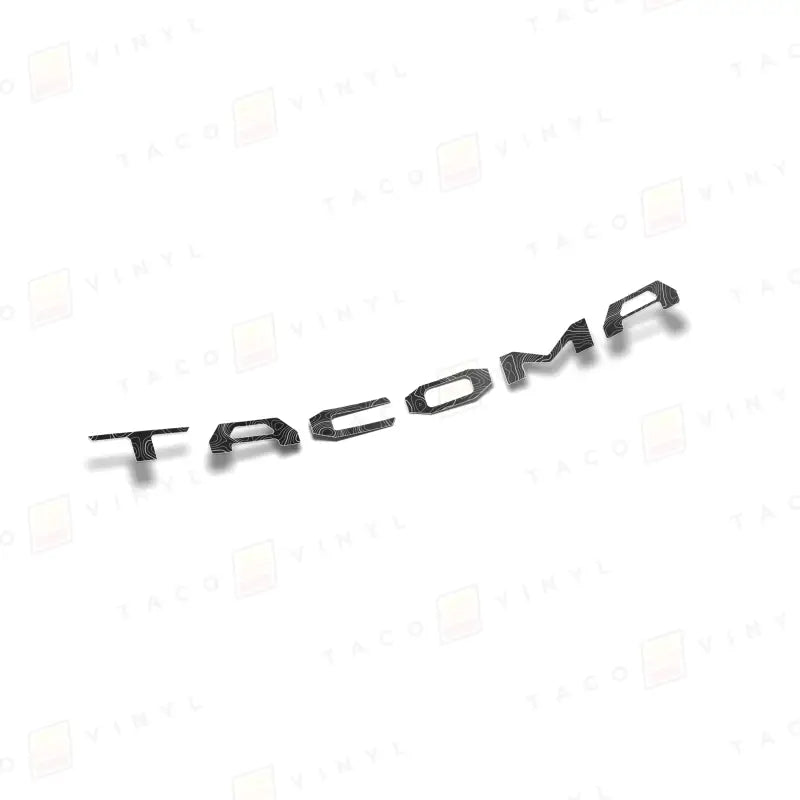 Black Tacoma lettering on air release vinyl for route protection on 2024+ Tacoma tailgate