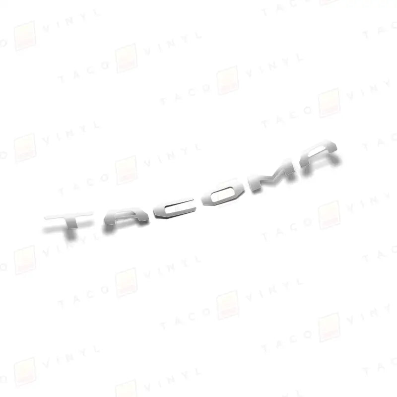 Silver TACOMA lettering on 2024+ Tacoma tailgate with air release vinyl for route protection