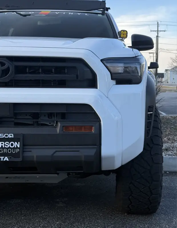 White Toyota truck front with 2025+ 4Runner fog light overlays and light overlays