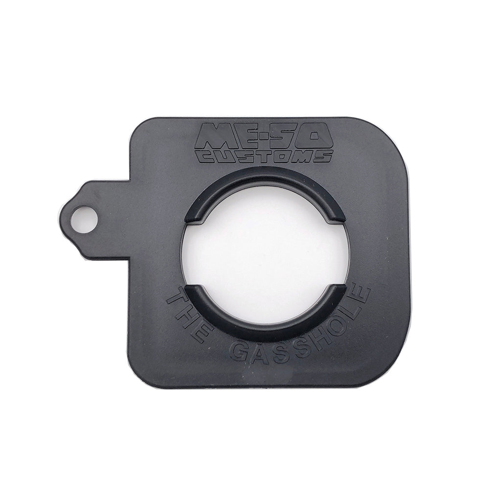 The Gasshole gas cap holder for 2005-2015 Toyota Tacoma, featuring durable black construction with 'ME-SO Customs' branding.