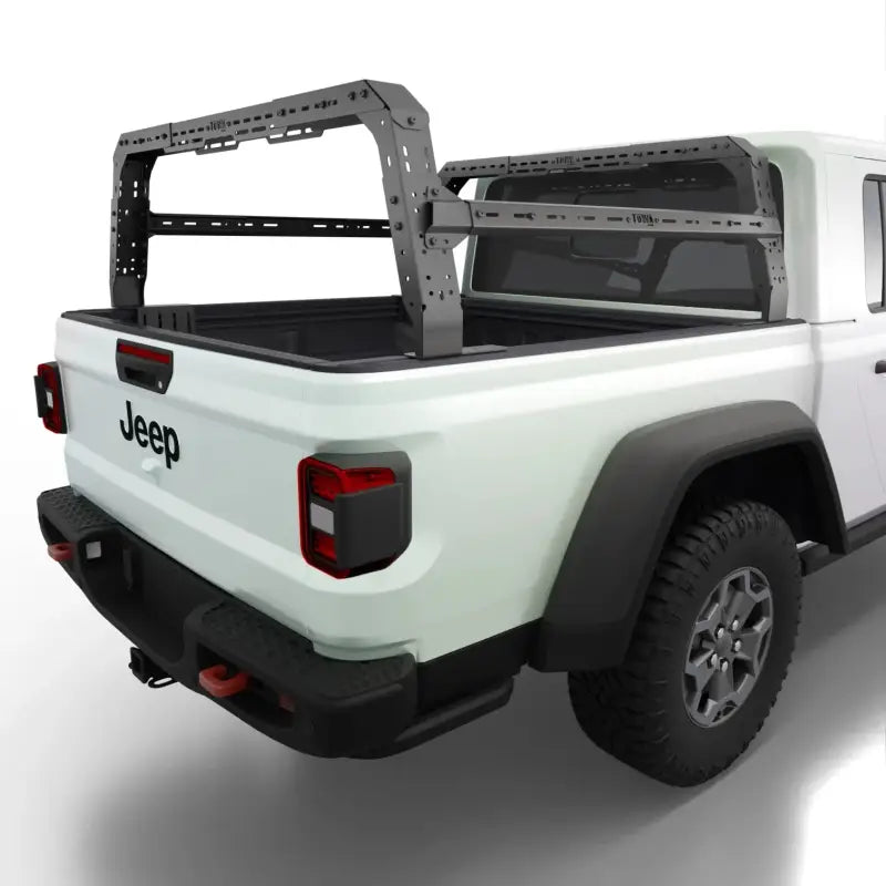 Jeep Gladiator with Shiprock height adjustable bed rack installed, showcasing durable steel construction and overlanding design.