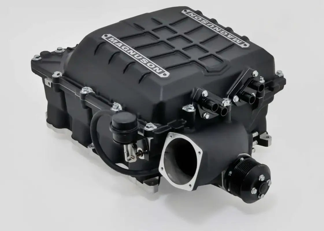 Close-up of the 19-21 Toyota Tundra 5.7L Magnum Supercharger System TVS2650, showcasing its black housing and precision-engineered components.