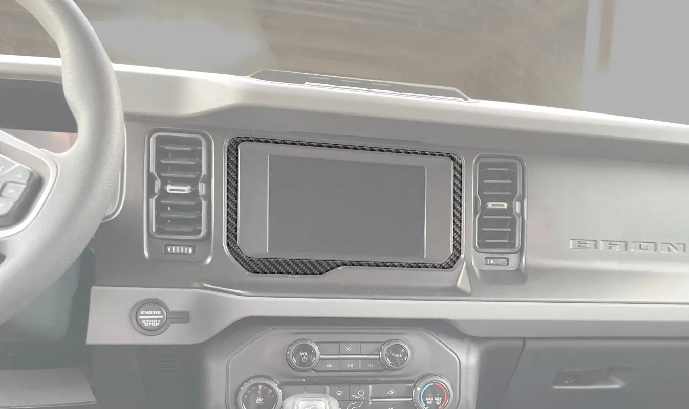 Car dashboard interior with 8 inch display screen accent overlay for Ford Bronco