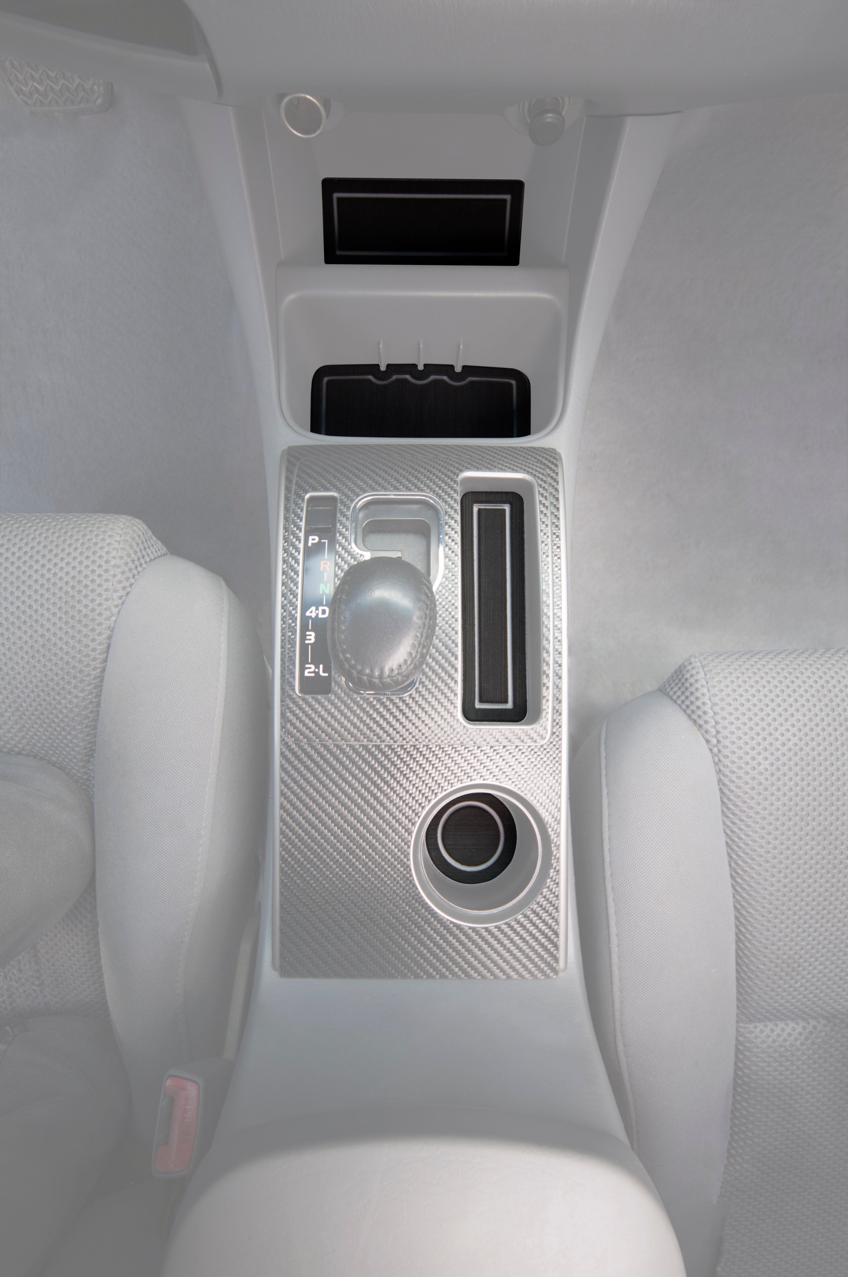 Foam cup holder inserts installed in the center console of a 2005-2015 Toyota Tacoma with automatic transmission, featuring a sleek design.