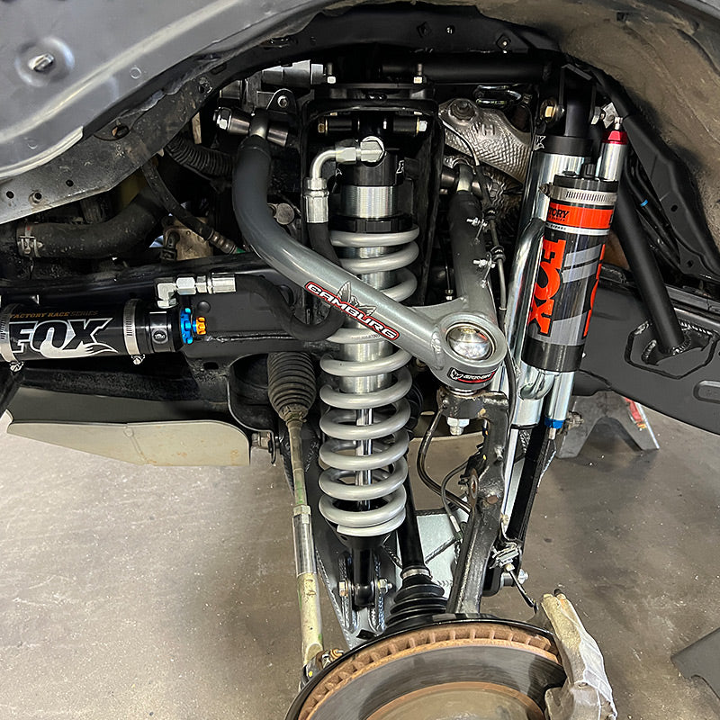 EIBACH coilover race spring installed in a vehicle suspension system with FOX shocks, showcasing advanced off-road performance setup.