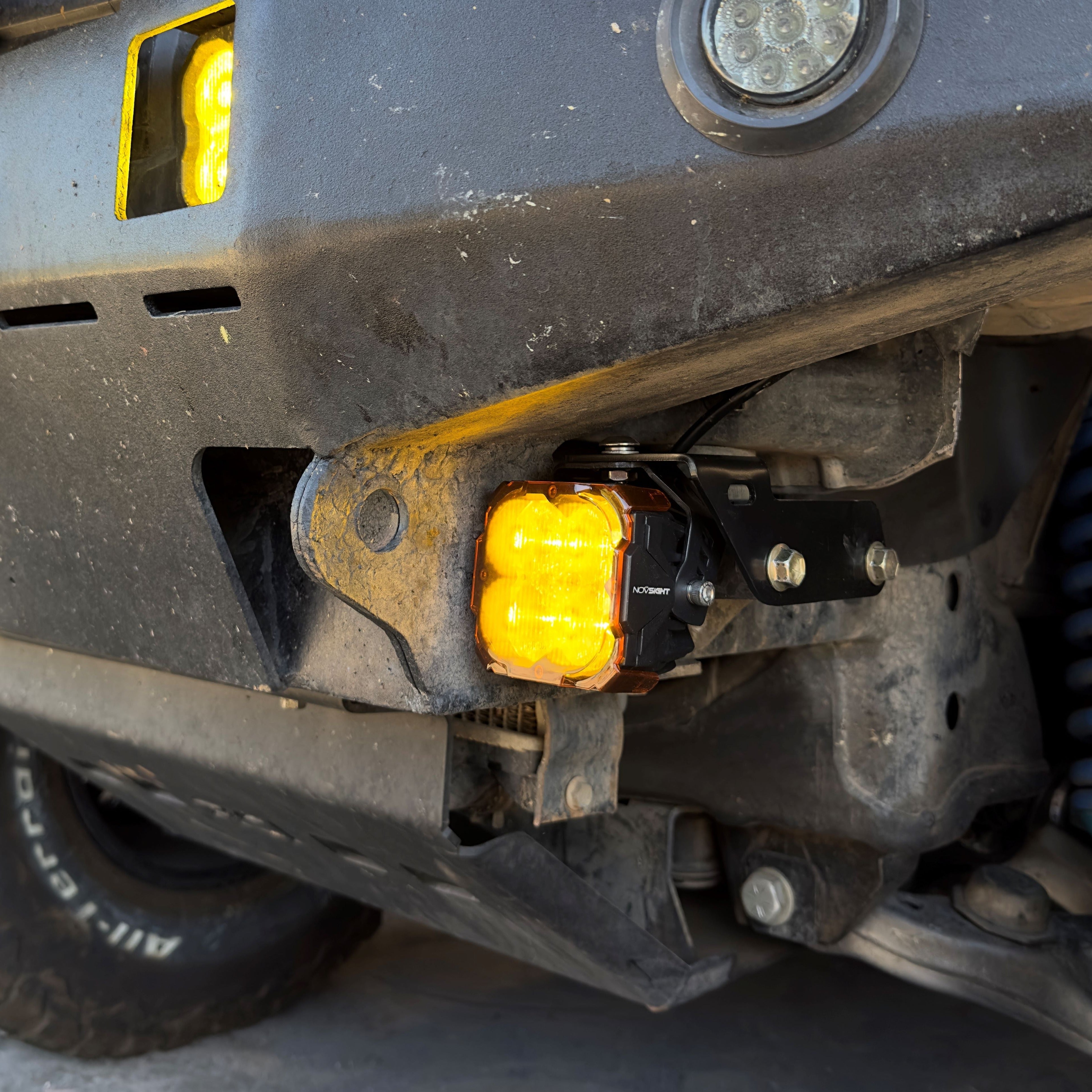 LED pod mounted on a high clearance bumper of a 1996-2002 Toyota 4Runner using powder-coated black brackets for off-road lighting.