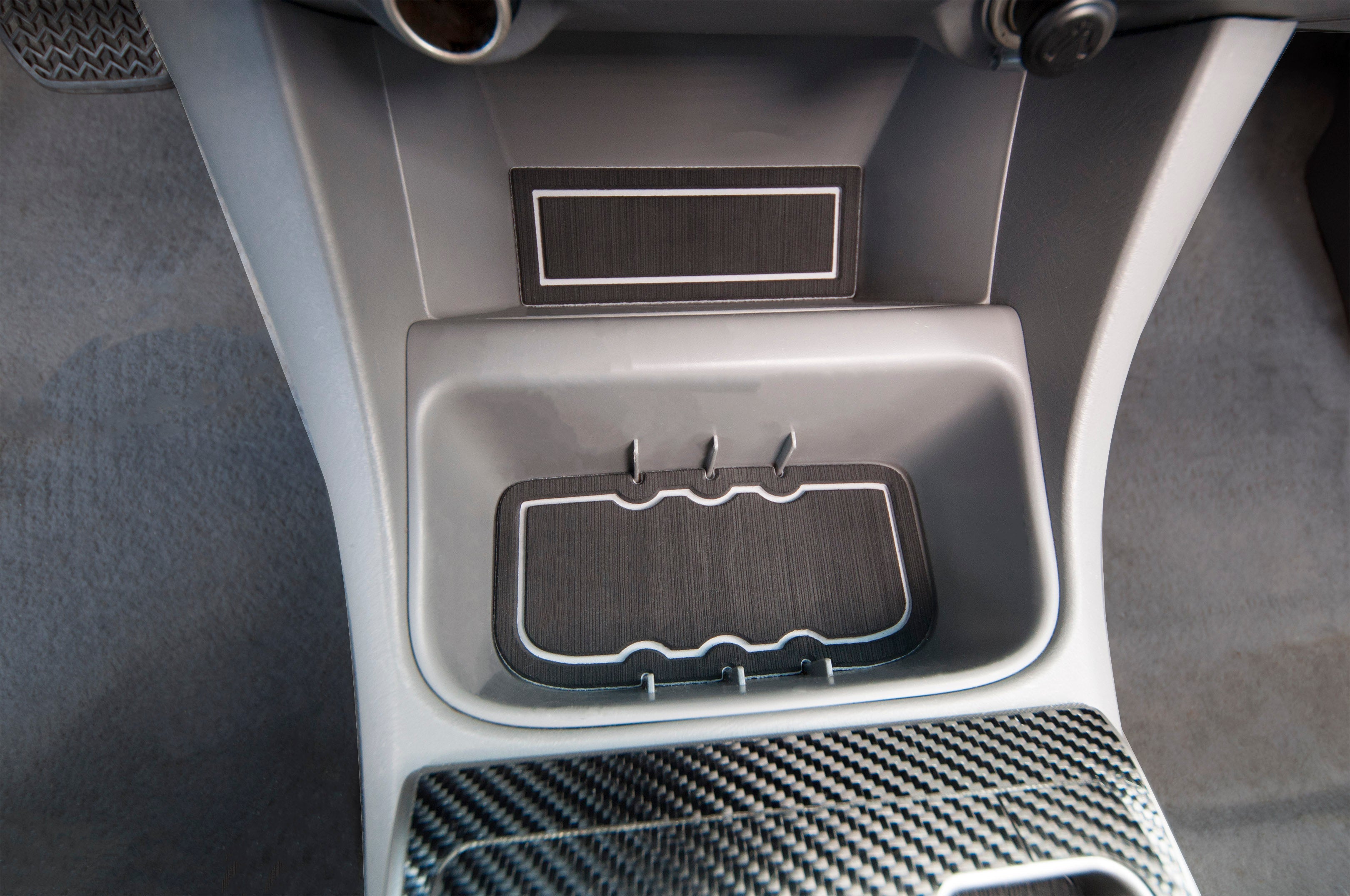 Detailed view of foam inserts in the storage compartment of a 2005-2015 Toyota Tacoma, providing a custom fit and protective lining.