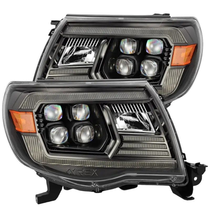 AlphaRex NOVA-Series projector headlights with smoked housing and quad LED projectors for Toyota Tacoma (2005-2011).