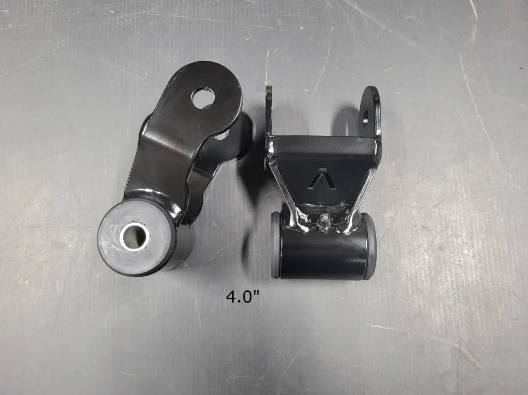 Black metal suspension shackles with poly bushings for 2G-3G Tacoma and 1G Tundra