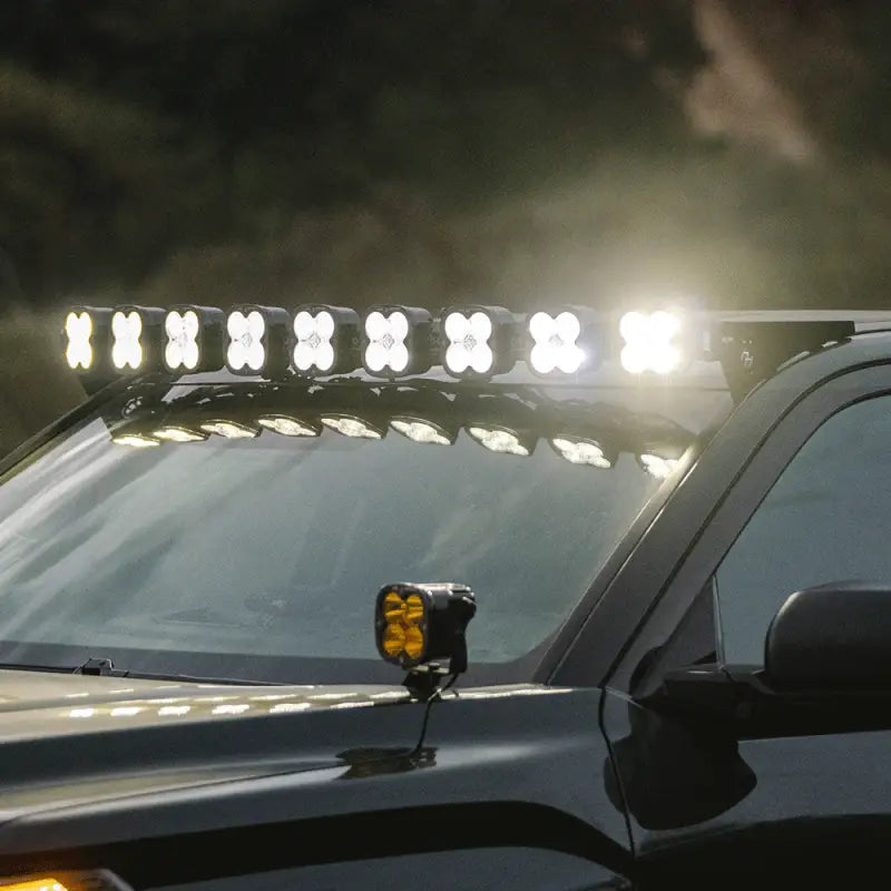 Close-up of Baja Designs 9XL Roof Bar on Toyota Tundra 2022+, illuminating with bright 28458 lumens for off-road visibility.
