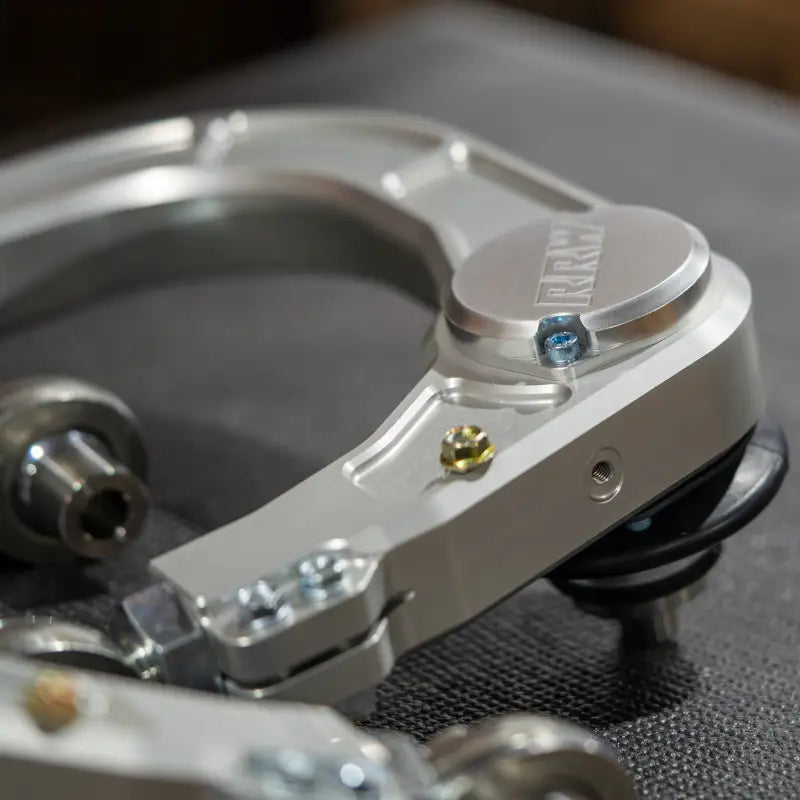 Silver metal suspension control arm for 2024+ Tacoma, GX550, Landcruiser with kevlar reinforced and precision machined finish