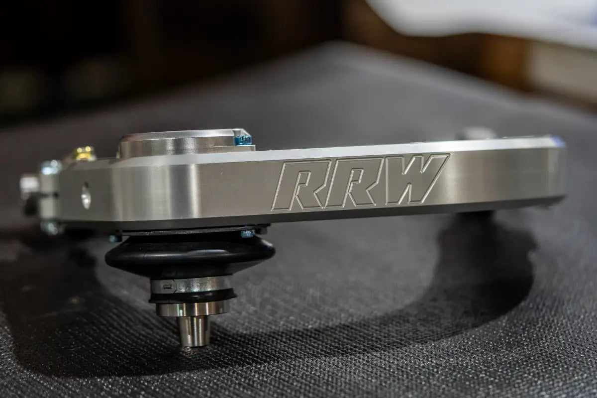 Silver metal automotive suspension component kevlar reinforced, sealed, precision machined for Tacoma and Landcruiser