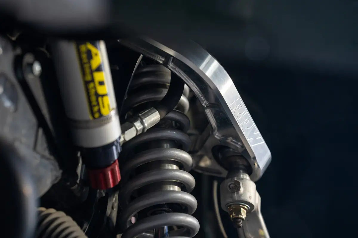 Silver coilover suspension system for Colorado ZR2 with kevlar reinforced, completely sealed FEA analyzed design