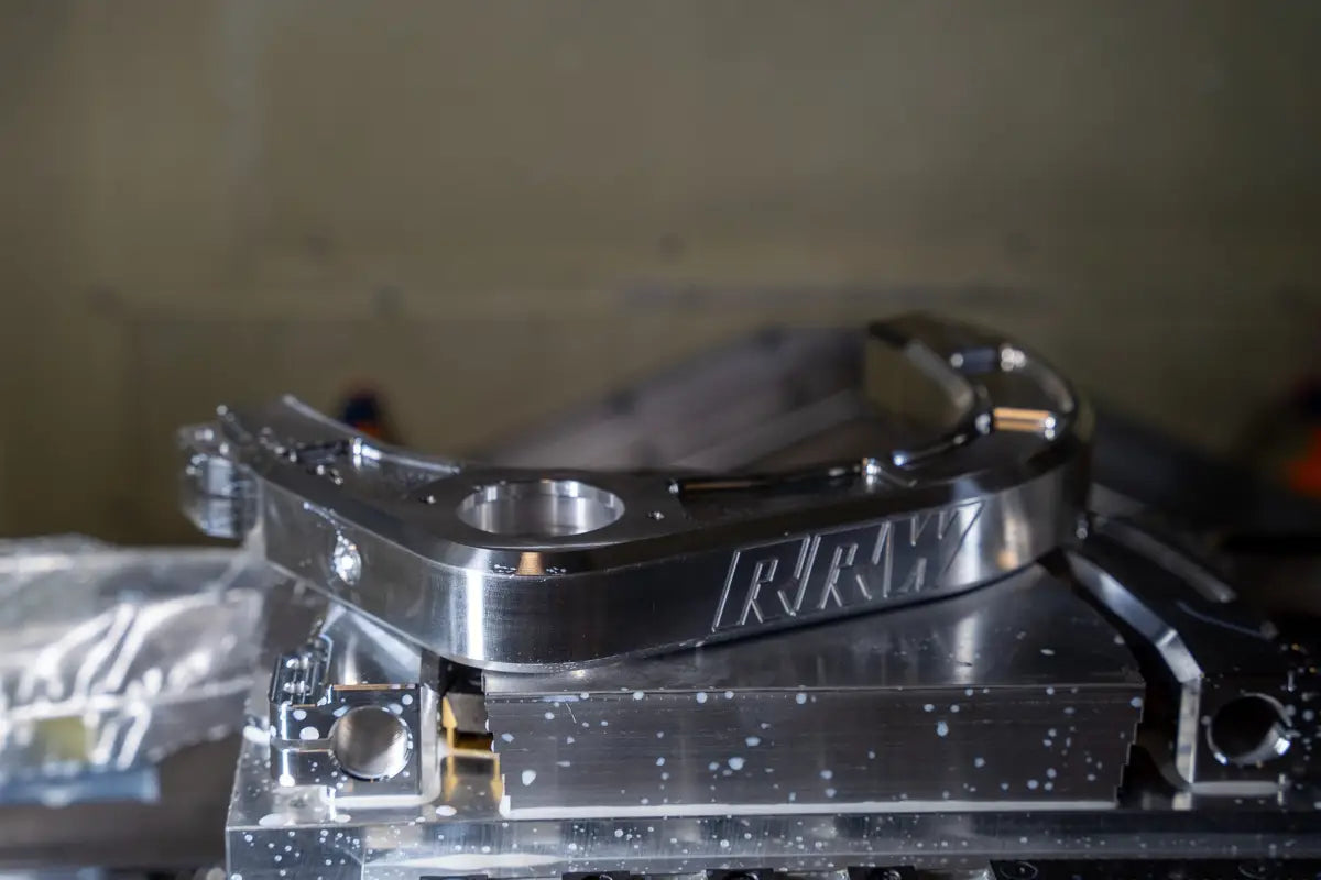 Shiny metal machined part of Billet Uniball UCA for Silverado 1500, kevlar reinforced and fully sealed