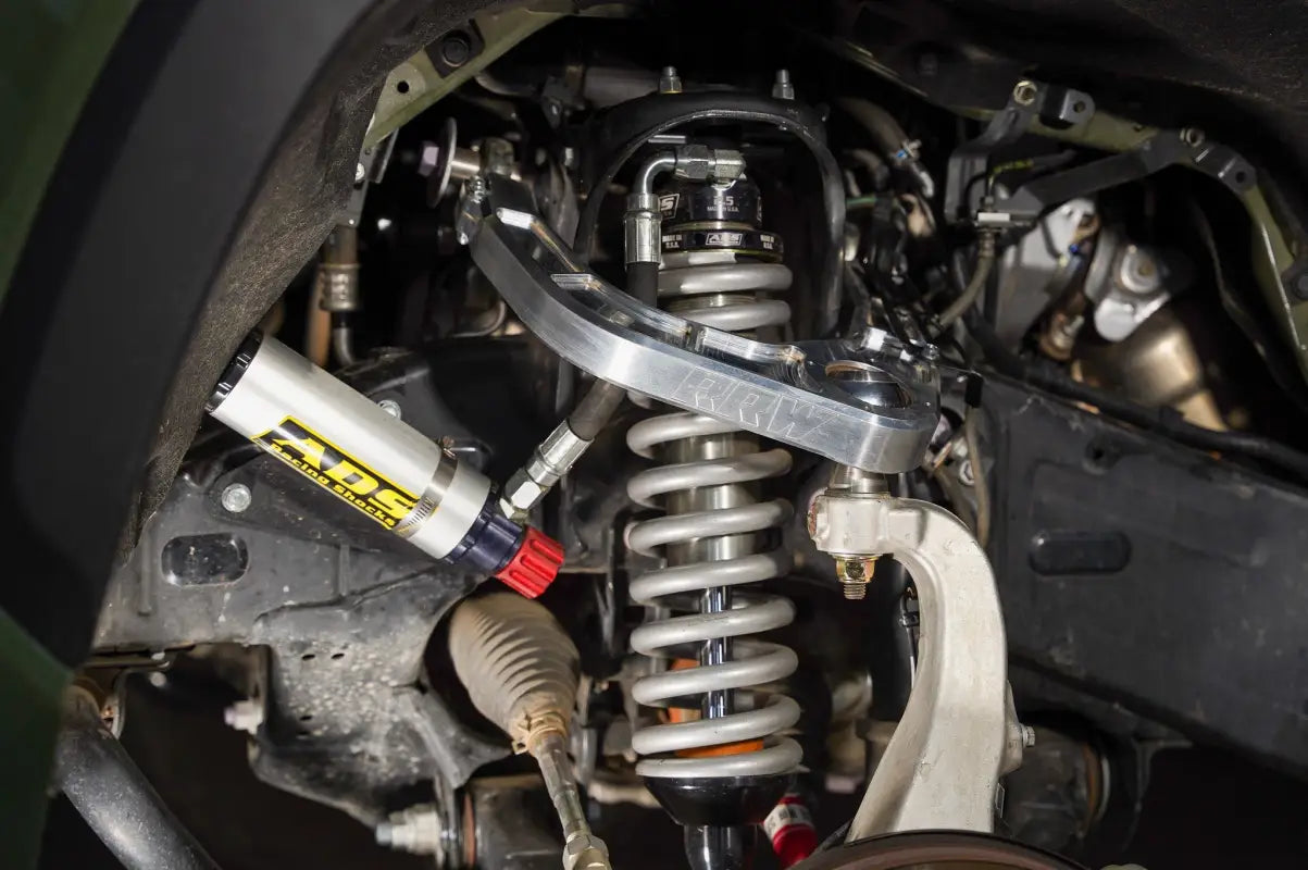 Truck suspension system with kevlar reinforced, completely sealed, and FEA analyzed Billet Uniball UCA for Silverado 1500