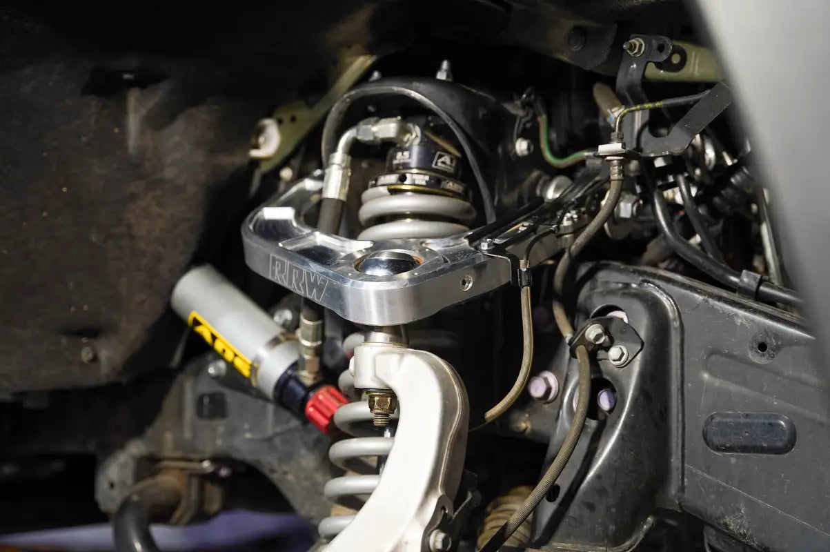 Automotive suspension system with billet uniball UCA for Silverado 1500, kevlar reinforced and fully sealed