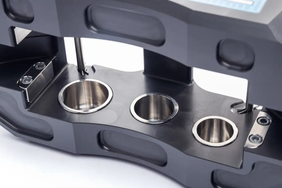 Interior view of the PowerBrake 6 piston caliper, showing the piston arrangement and high-quality machining.
