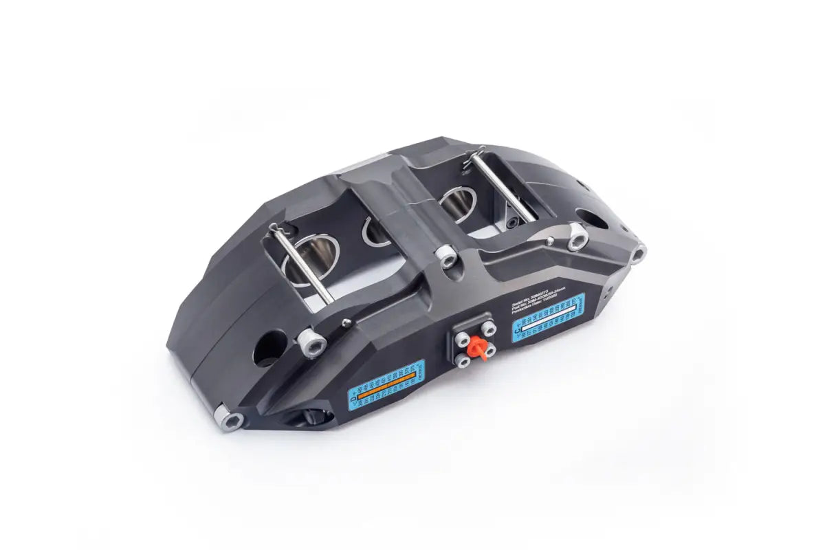 Angled view of the PowerBrake 6 piston caliper, highlighting its robust design and technical specifications.