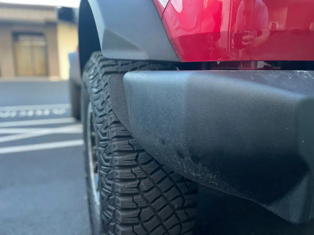 Red vehicle’s tire and bumper with Bumper End Caps Fits 2021-2024 Ford Bronco