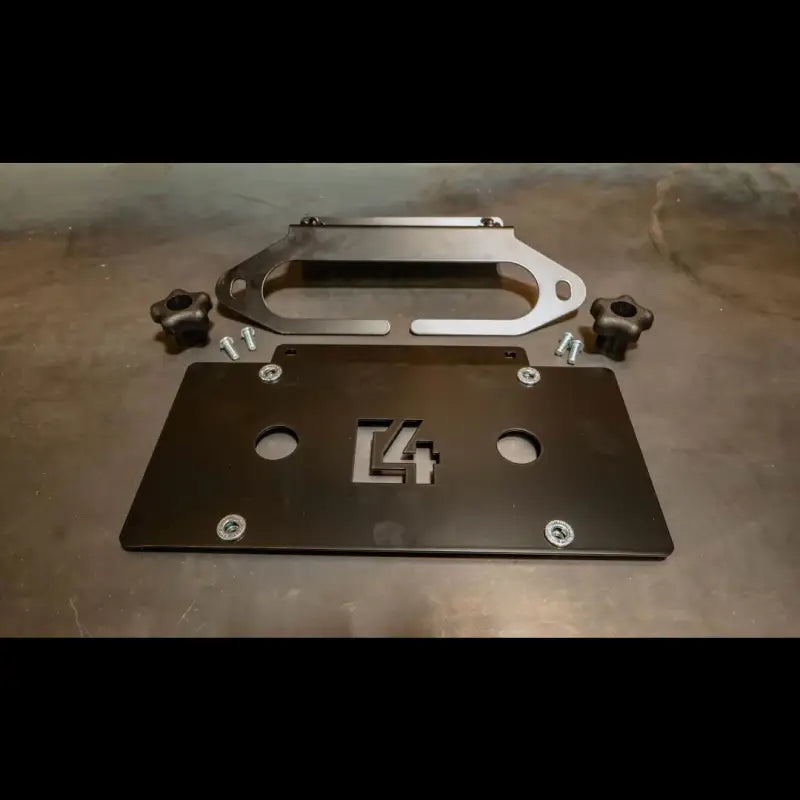 C4 Hawse License Plate Mount components, including a black steel plate, mounting hardware, and adjustable knobs, designed for hawse fairlead compatibility.