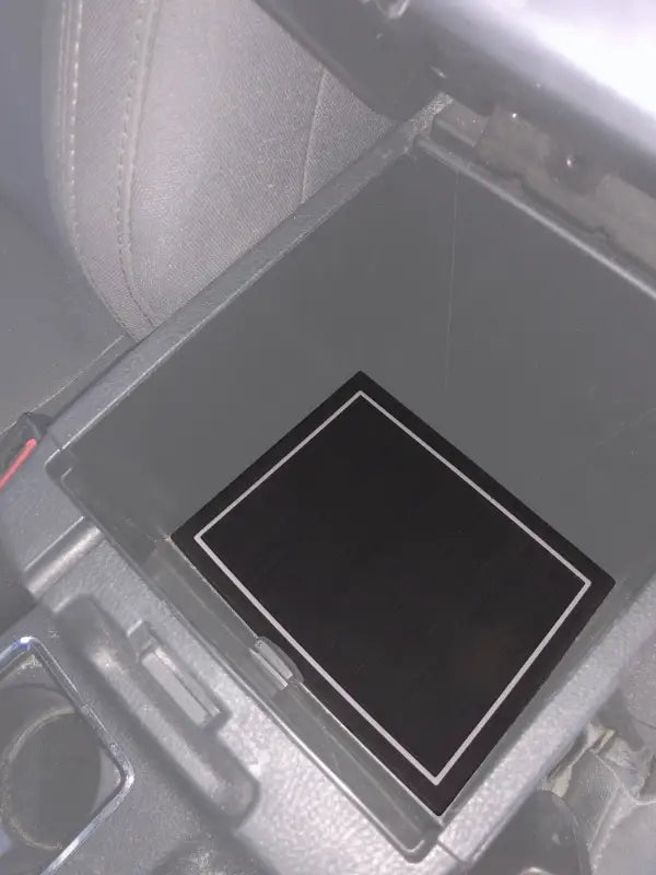 Center storage compartment foam insert installed in a 2016-2023 Toyota Tacoma, providing a snug fit and protective surface.