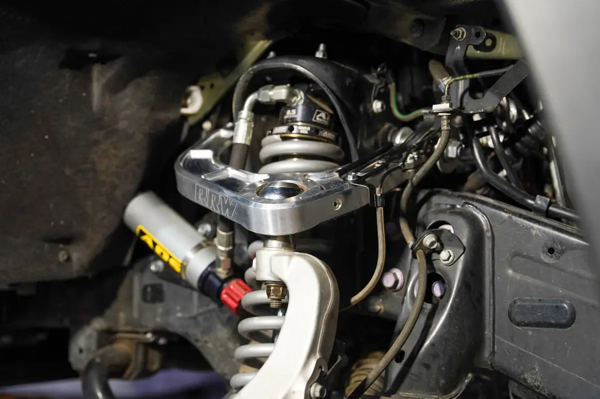 CNC Billet Upper Control Arm installed on a 2022+ Toyota Tundra, showcasing compatibility with advanced suspension systems for improved handling.