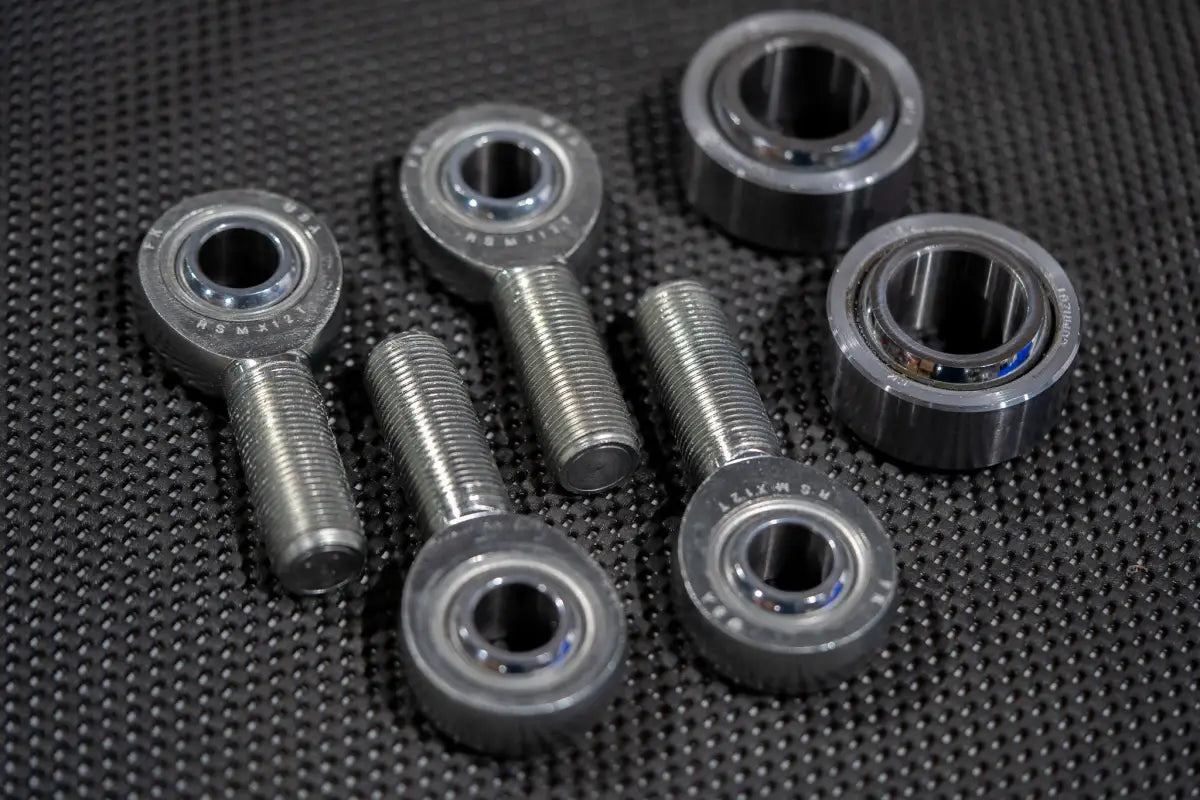 Set of heim joints and bolts for CNC Billet Upper Control Arm, precision-engineered for Toyota Tundra 2022+ suspension upgrades.