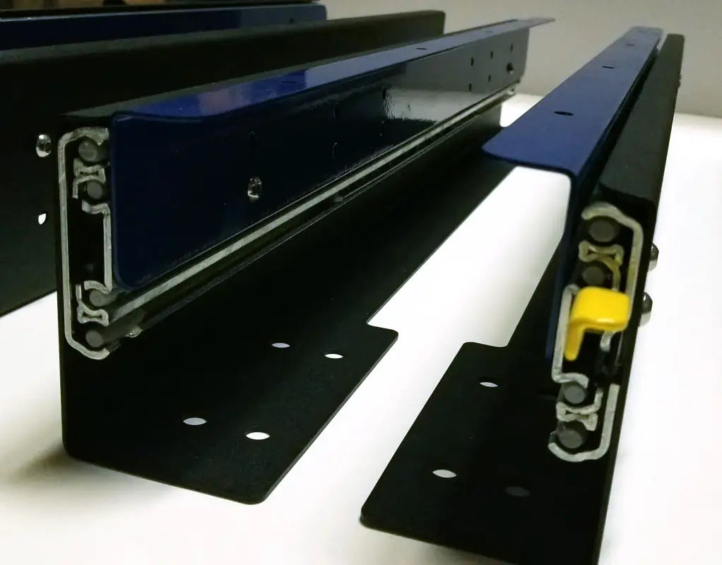 Close-up view of DIY slide tracks with yellow locking mechanism, showcasing robust build and precision engineering.