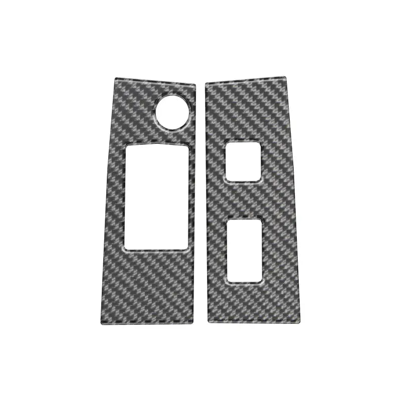 Two carbon fiber door switch panel accent overlays with switch cutouts, compatible with 2016-2023 Toyota Tacoma models.