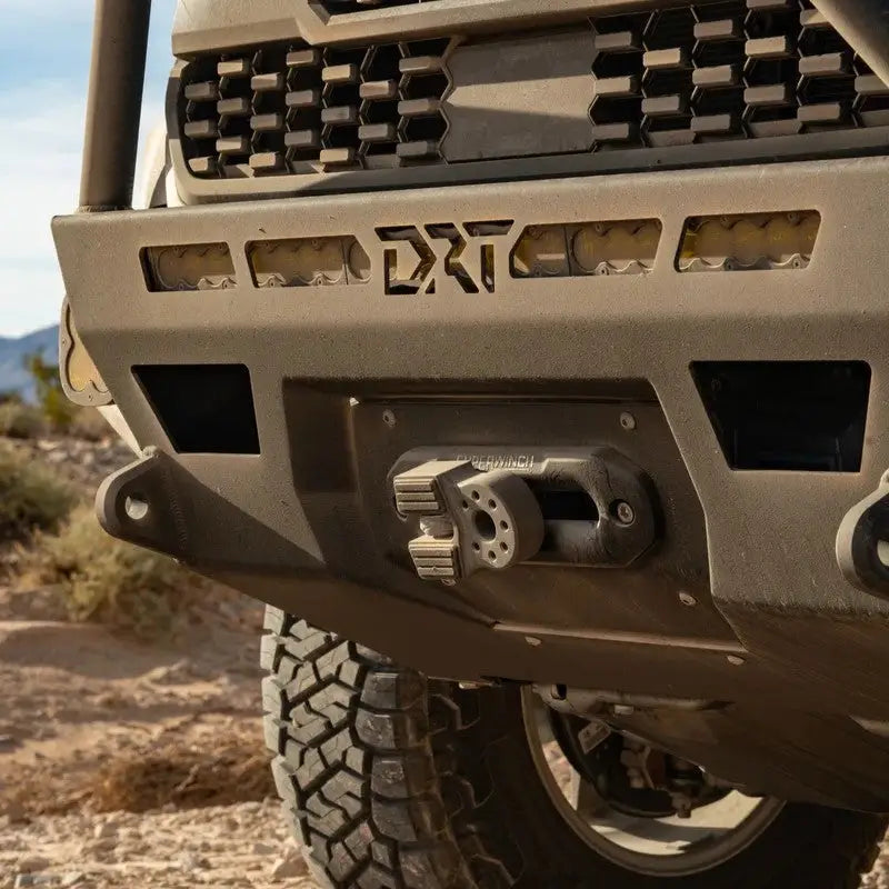 Close-up of DRT Hybrid Front Bumper on a 2016-2023 Toyota Tacoma showcasing durable steel construction and winch mount.