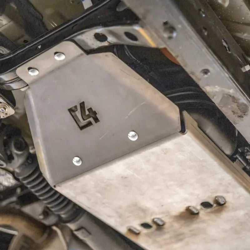Tacoma fuel tank skid plate installed on a 3rd Gen 2016+ vehicle, showcasing bolt-on steel construction for undercarriage protection.
