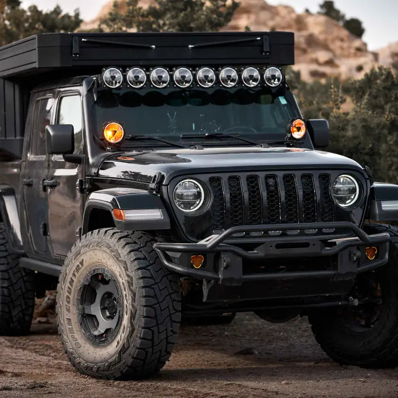 Black off-road vehicle with Gravity® Titan™ 6-inch LED lights, highlighting their rugged design and powerful illumination.