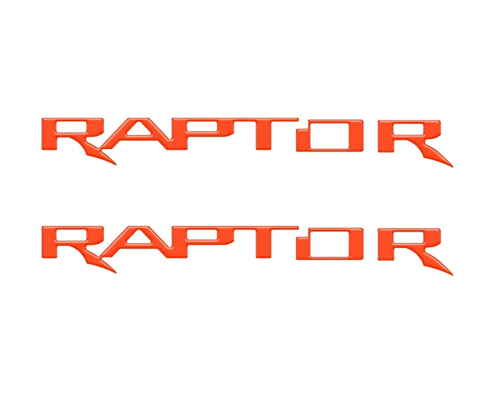 Two orange Raptor hood cowl emblem inserts for Ford F-150 and Bronco Raptor