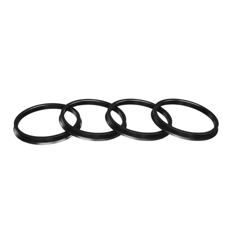 Set of 4 black hub centric rings for wheel alignment and vibration reduction. Designed for precise fitment on various vehicle models.