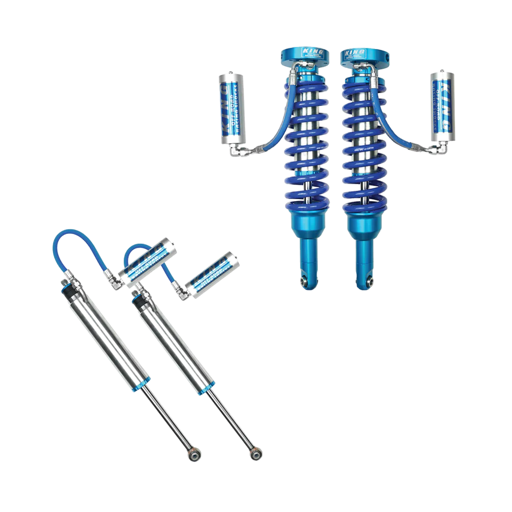 King 2.5 mid travel suspension kit for Toyota Tacoma (05-23), including front coilovers and rear shocks with external reservoirs for optimal performance.