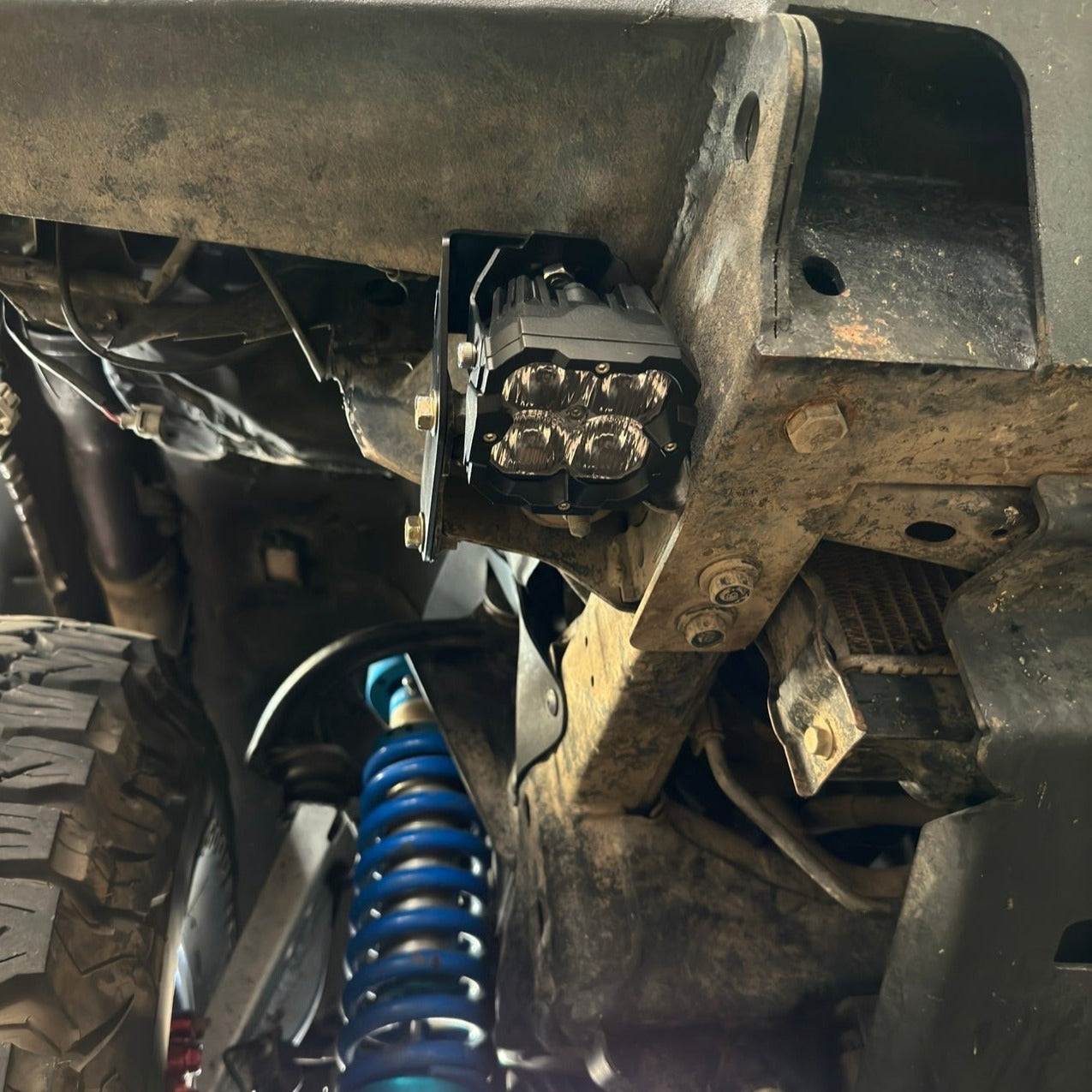 Underbody view of a 1996-2002 Toyota 4Runner with LED pod mounted on a high clearance bumper using black powder-coated brackets.