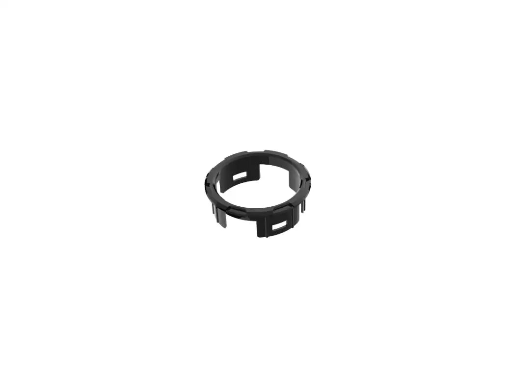 Black circular trim piece from the chrome delete kit for Toyota Tacoma 2016-2023, offering a custom-fit design.