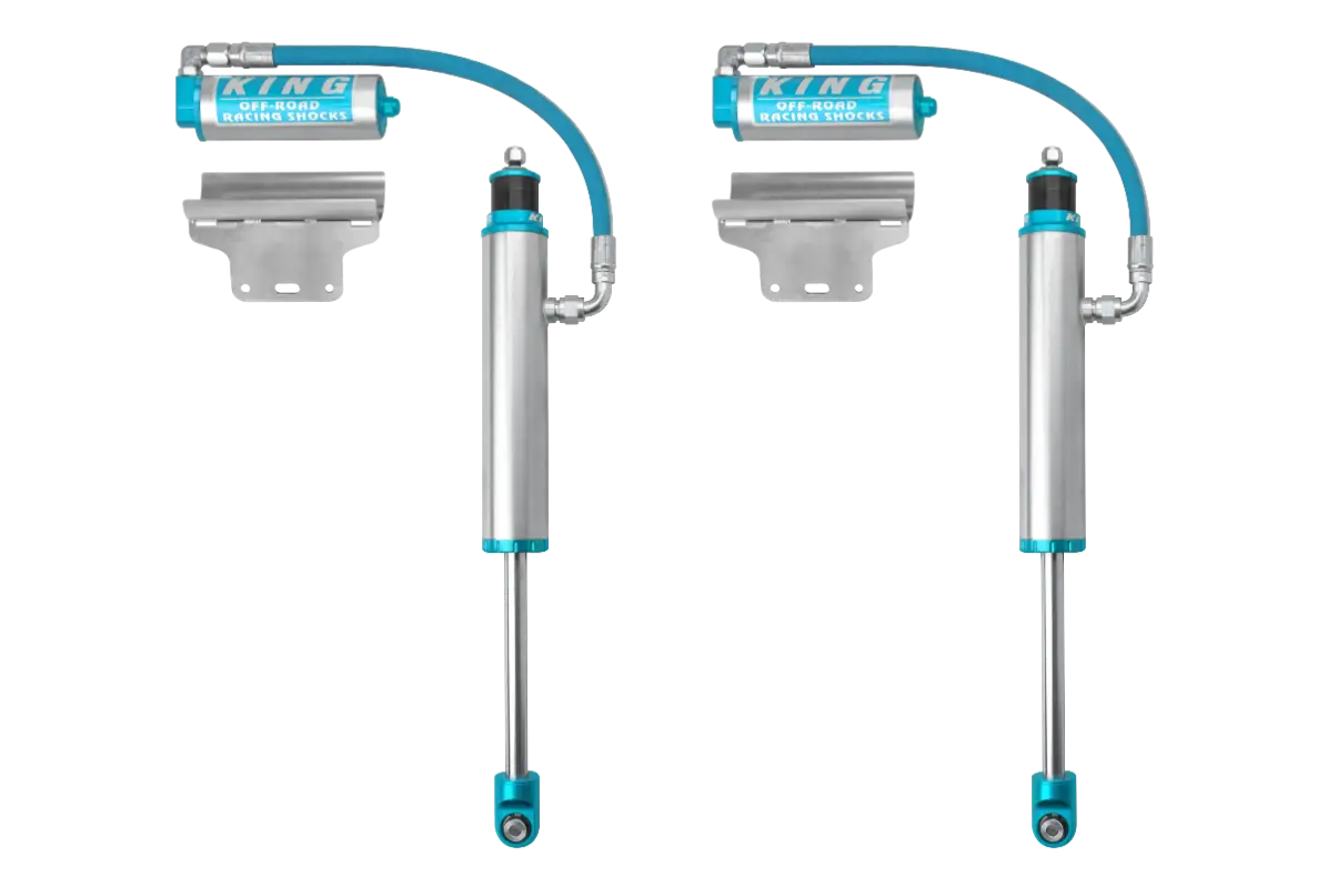 Pair of King 2.5 rear shocks with external reservoirs for Toyota Tacoma, designed for 0-1.5 inch lift and off-road performance.