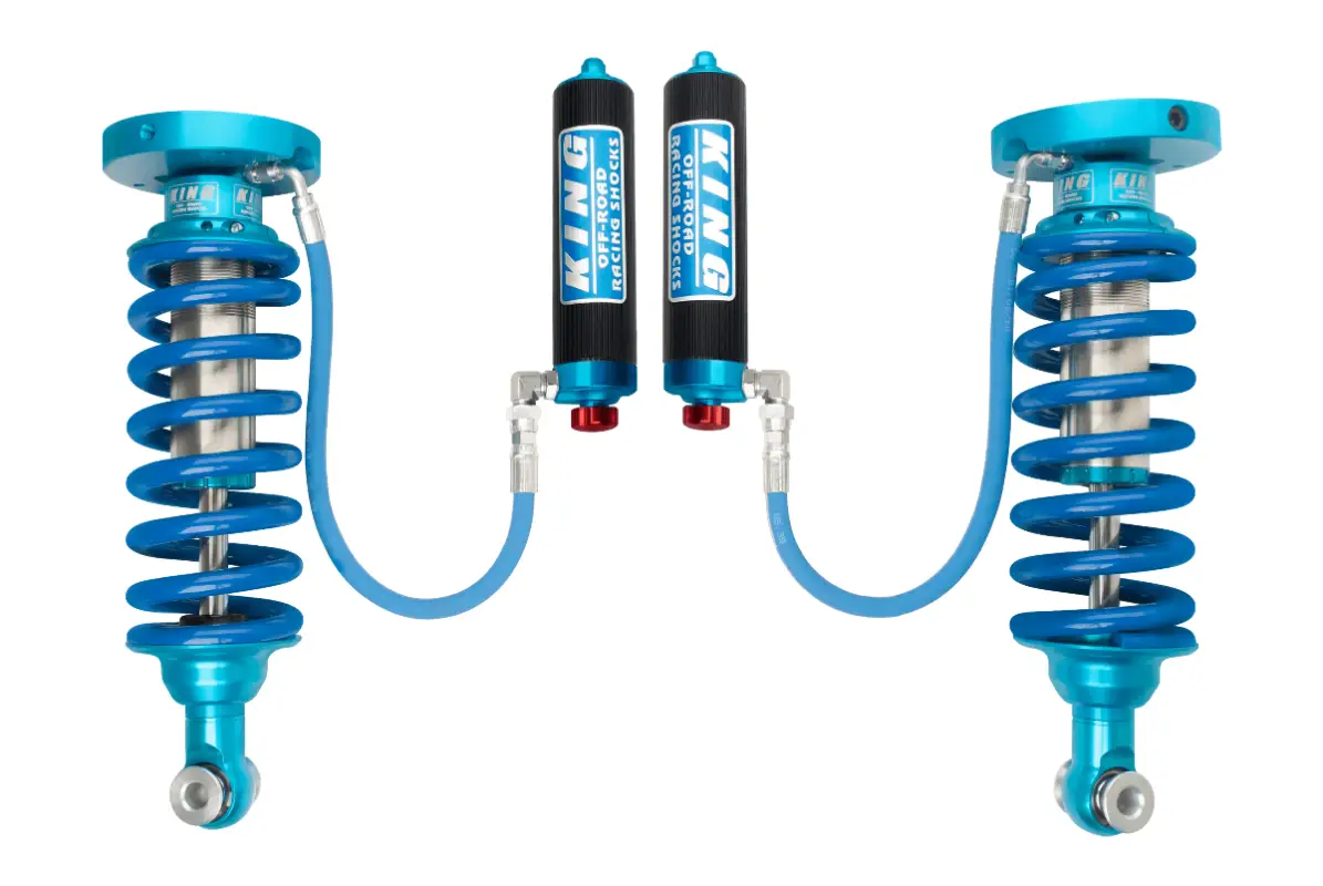 Adjustable King 2.5 Coilover Kit for 18-23 Ford Expedition with blue springs and remote reservoirs for superior ride control and durability.