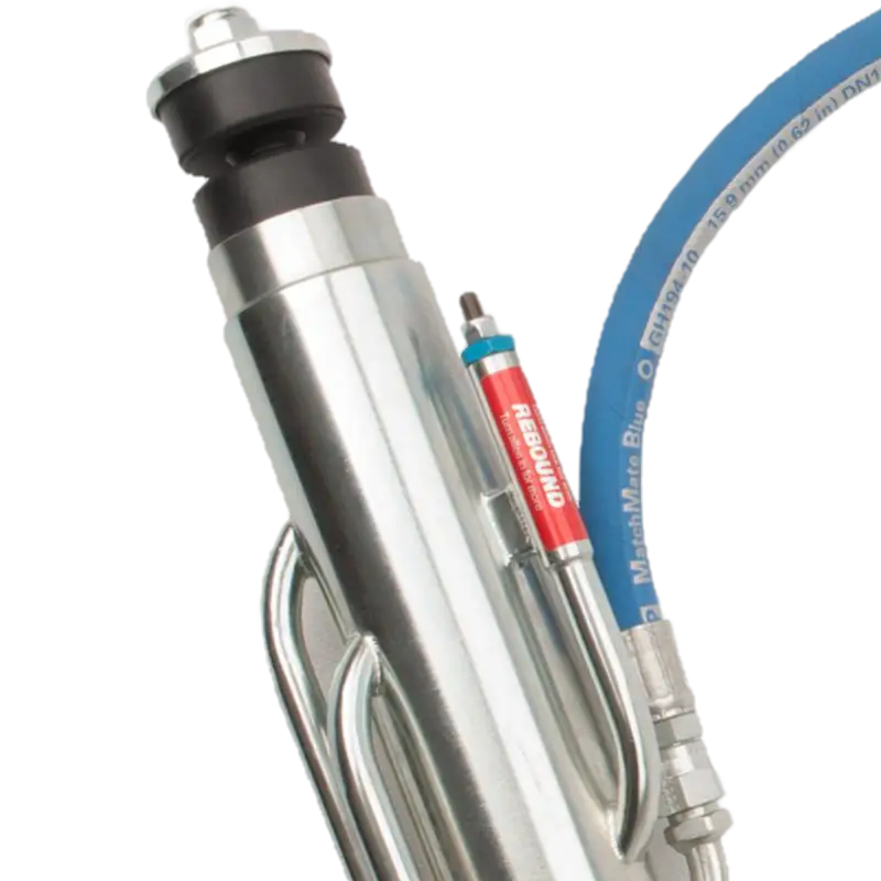 Detailed view of King 3.0 rear bypass shock upper section with rebound adjuster and braided hose for Toyota Tundra 2007-2021.