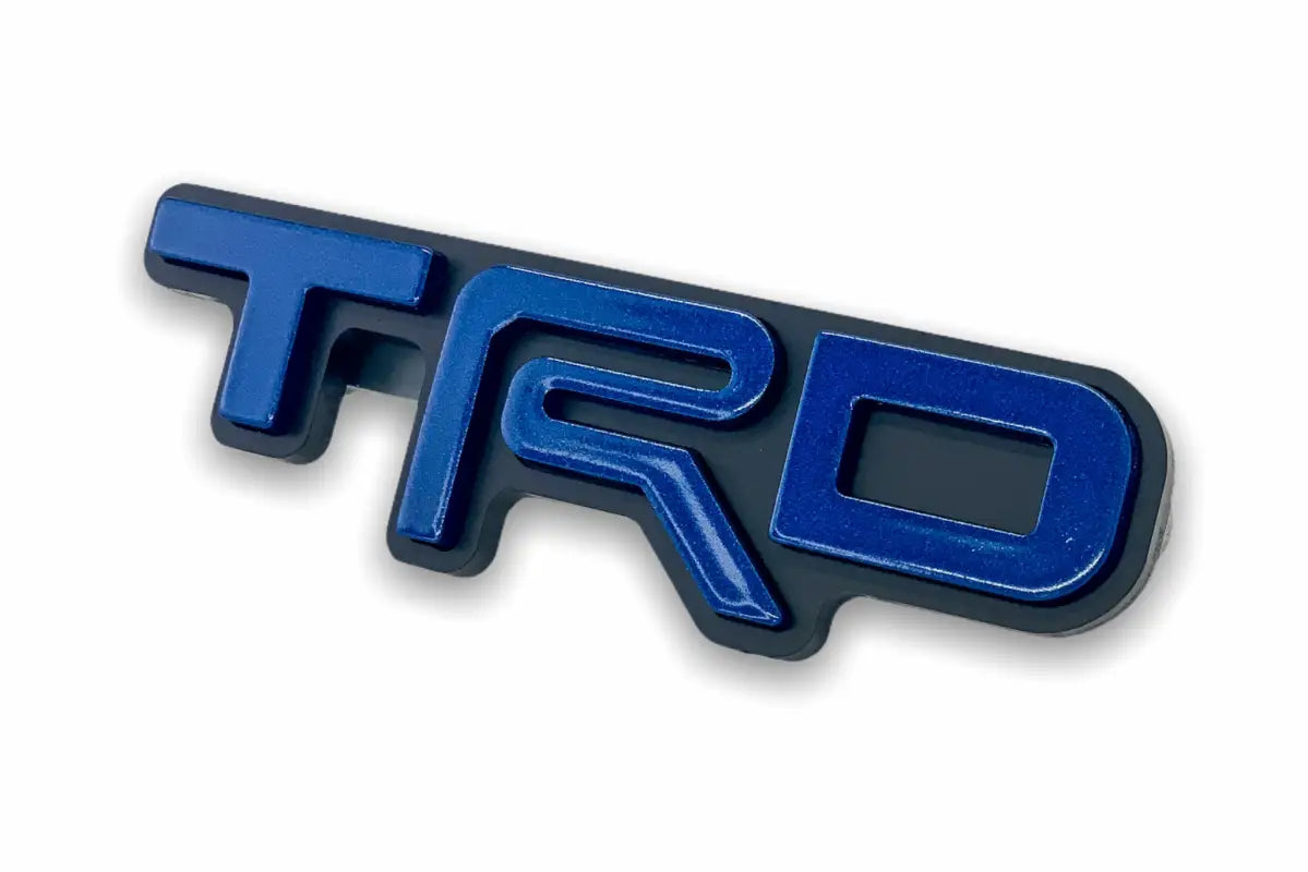 Blue TRD emblem logo grille badge for route protection on Toyota vehicles