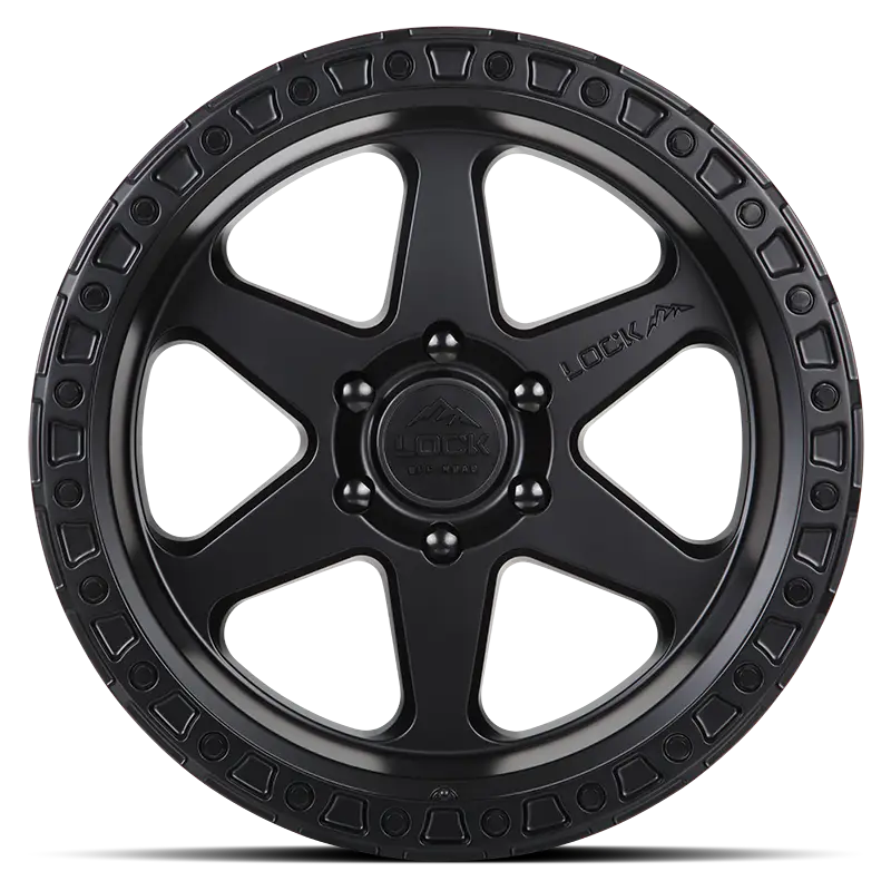 Front view of the OLYMPUS Matte Black wheel showcasing its tri-beam design and rugged detailing, ideal for off-road and stylish automotive applications.
