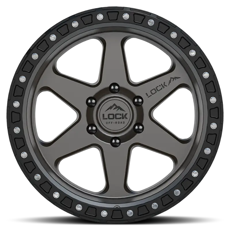 Front view of OLYMPUS-MATTE GREY lock rim with a sleek matte grey finish, tri-beam design, and riveted accents for rugged performance.