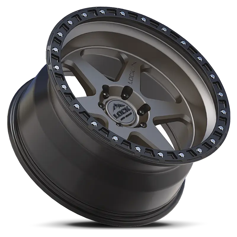 Angled view of OLYMPUS-MATTE GREY lock rim showcasing its deep lip, matte grey finish, and robust tri-beam design for off-road durability.
