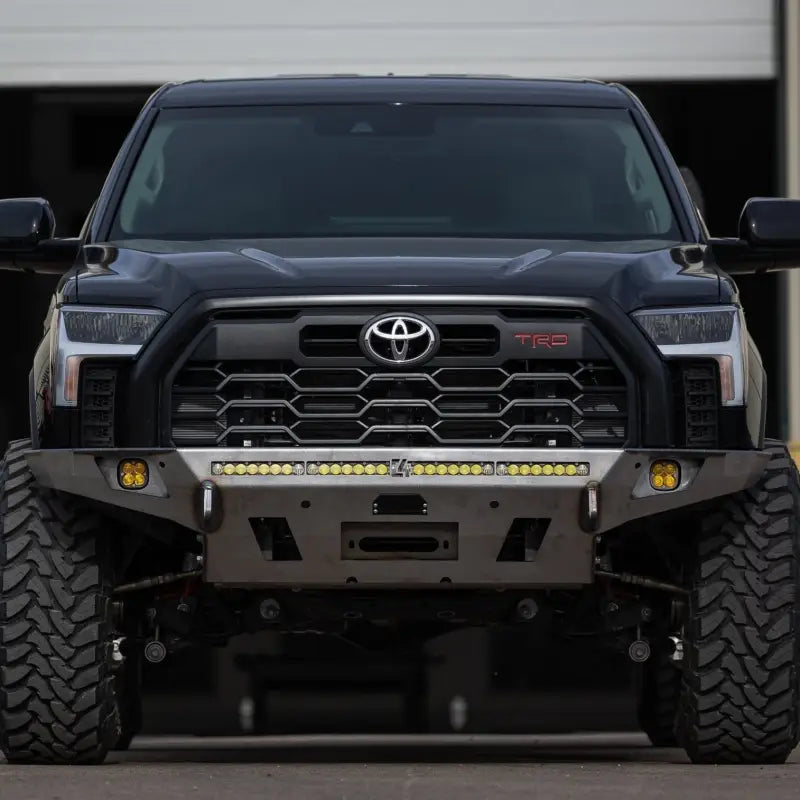 Tundra Overland Front Bumper for 3rd Gen 2022+ with winch and light bar compatibility, shown on a black Tundra with rugged tires.