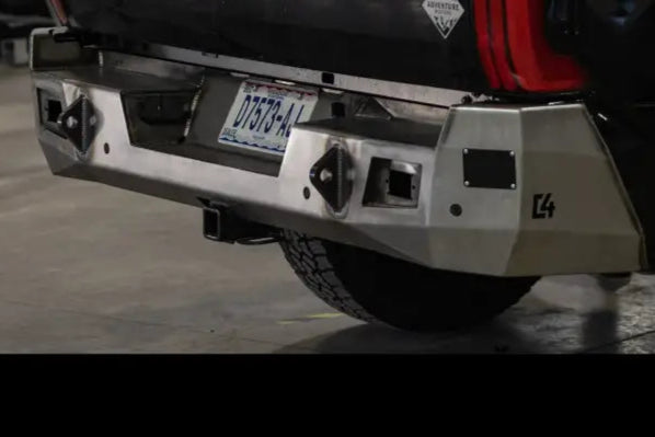 Tundra Overland Rear Bumper for 2022+ models in raw steel finish, featuring reverse lights and sensor support, mounted on black truck.