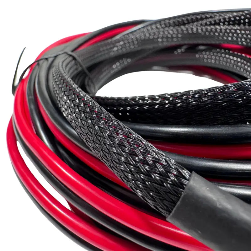 Bundles of red and black electrical wires with protective sleeving in a Power Supply Kit