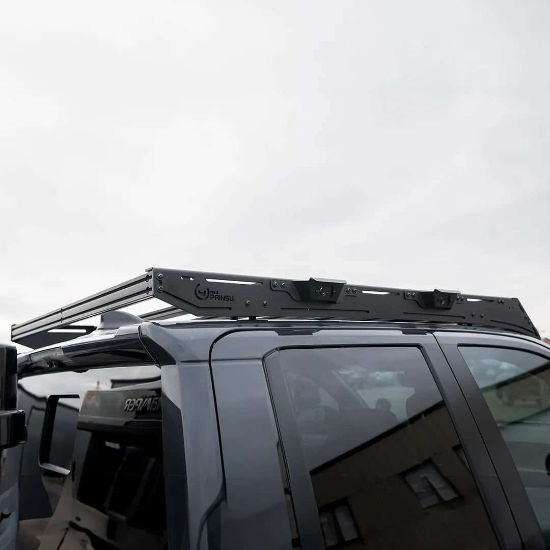 Prinsu Pro Cab Roof Rack installed on a gray Toyota Tacoma, showcasing its low-profile design and compatibility with roof-mounted accessories.